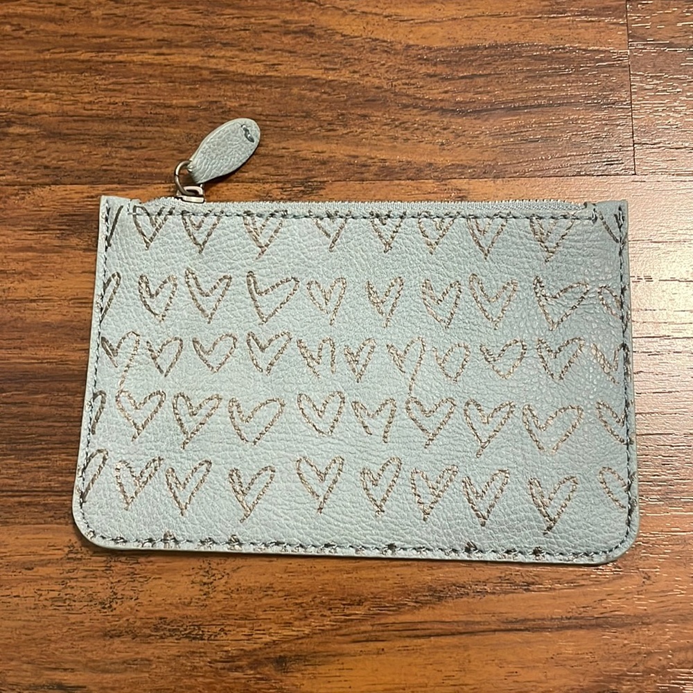 Loft small coin purse. Blue/gray color with grey hearts. Grey zipper.
